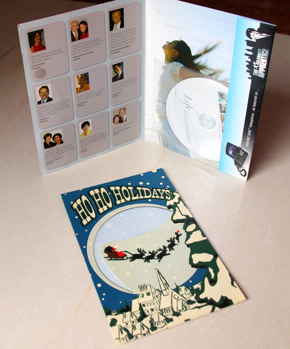 dvd in plastic sleeve then stick on cardboard gift packaging
